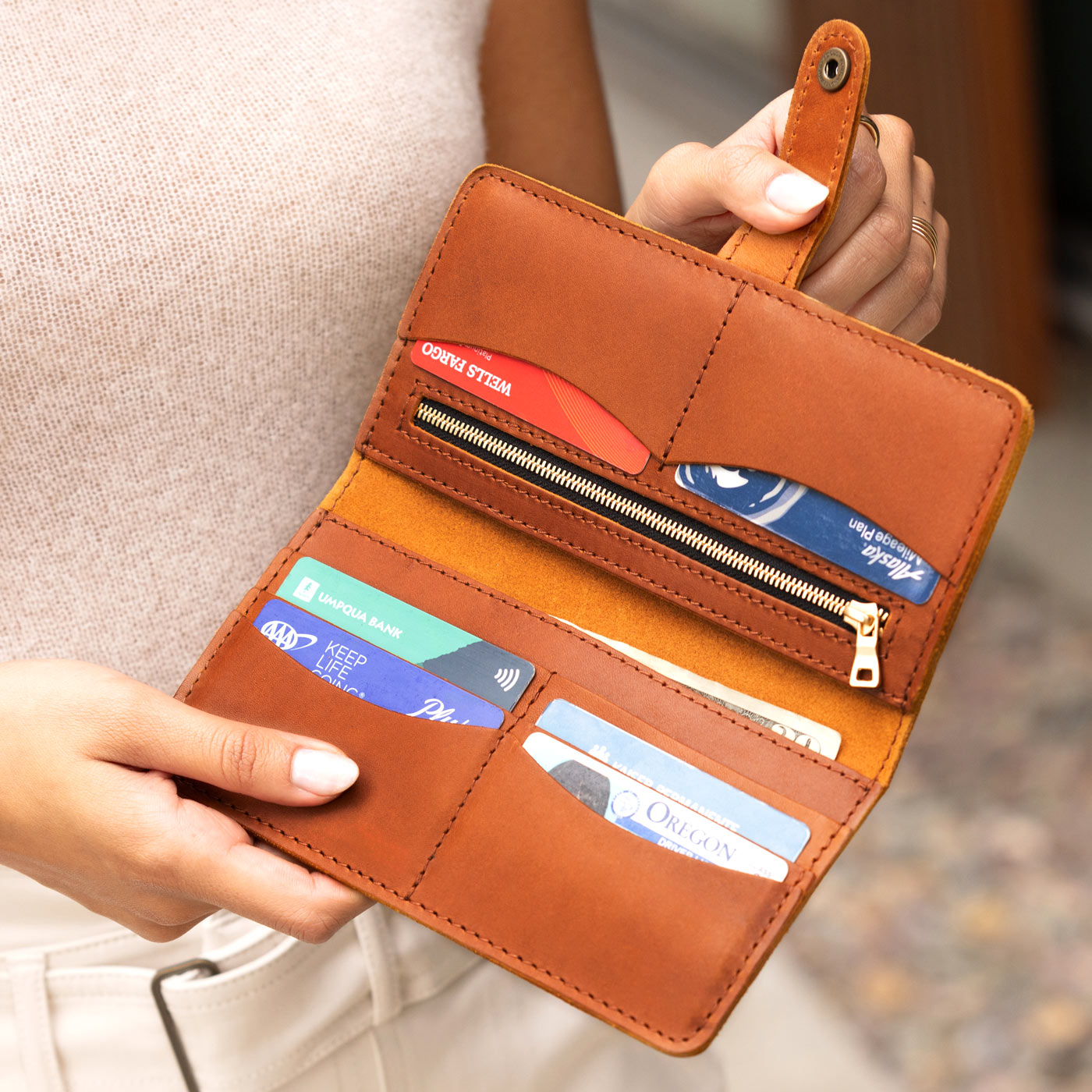 Honey | Model holding open leather wallet