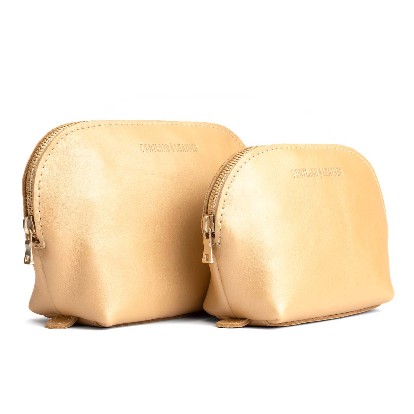 Champagne | Leather makeup bag with curved top zipper and flat bottom