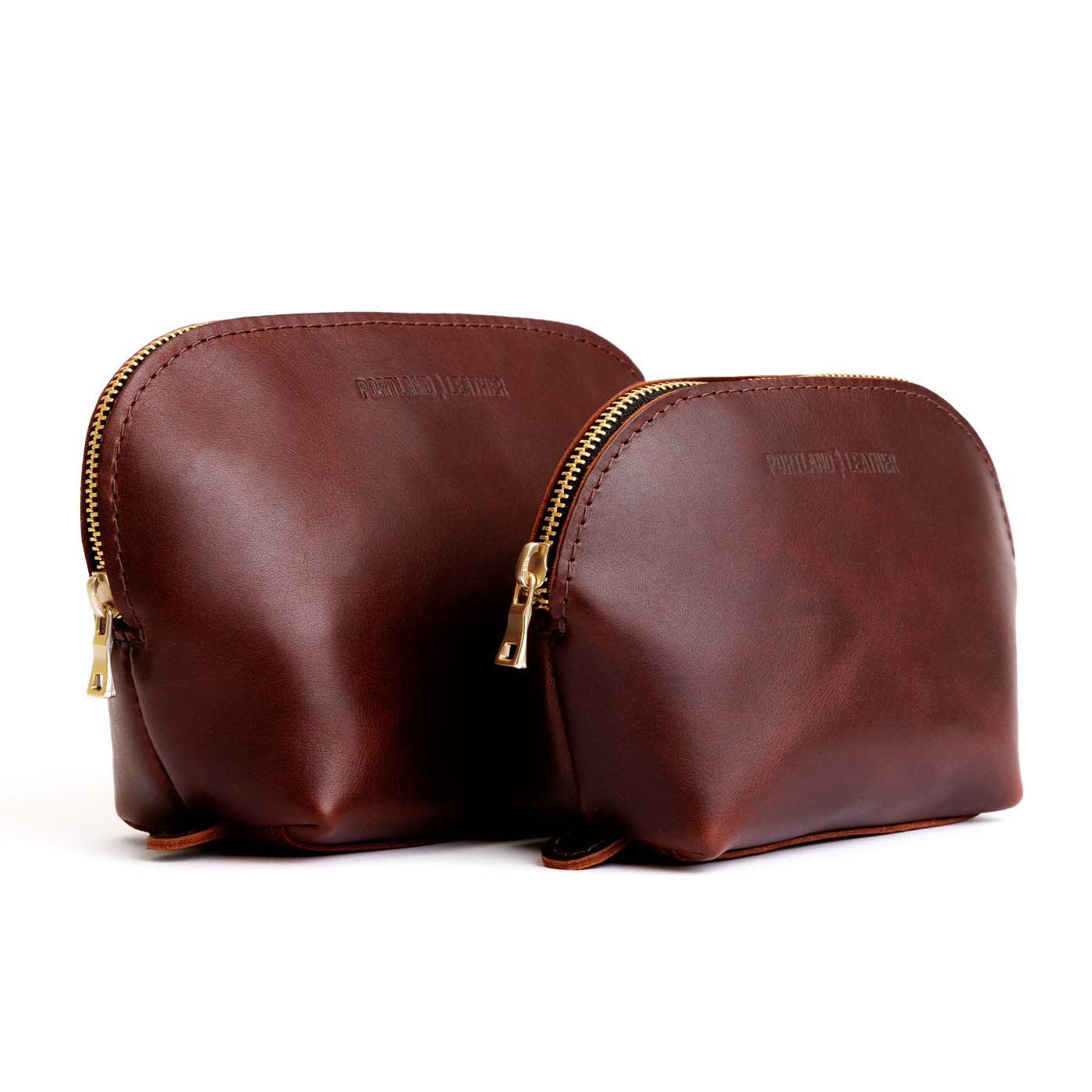 Cognac | Leather makeup bag with curved top zipper and flat bottom