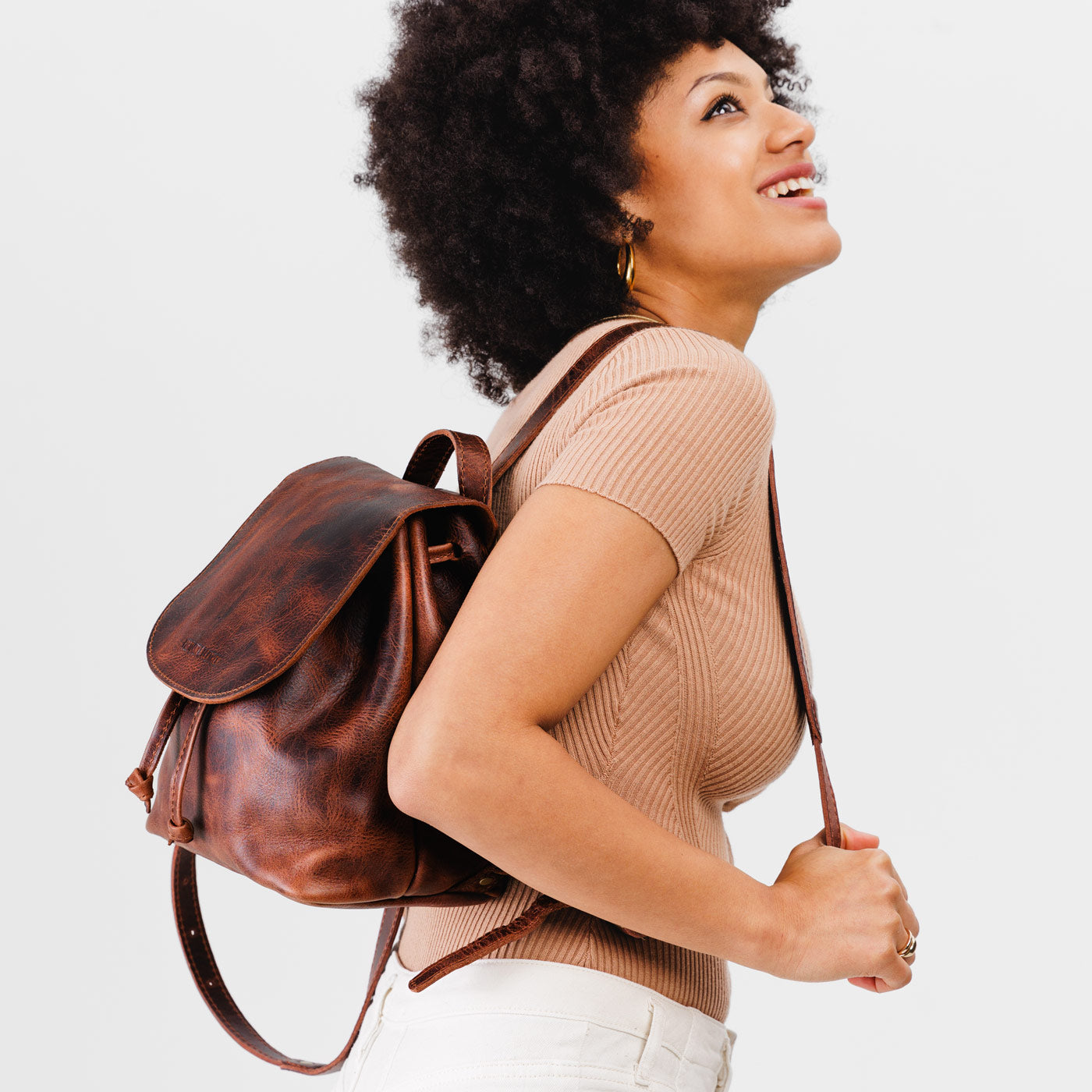 All Color: Lava | Model wearing slouchy leather bucket backpack