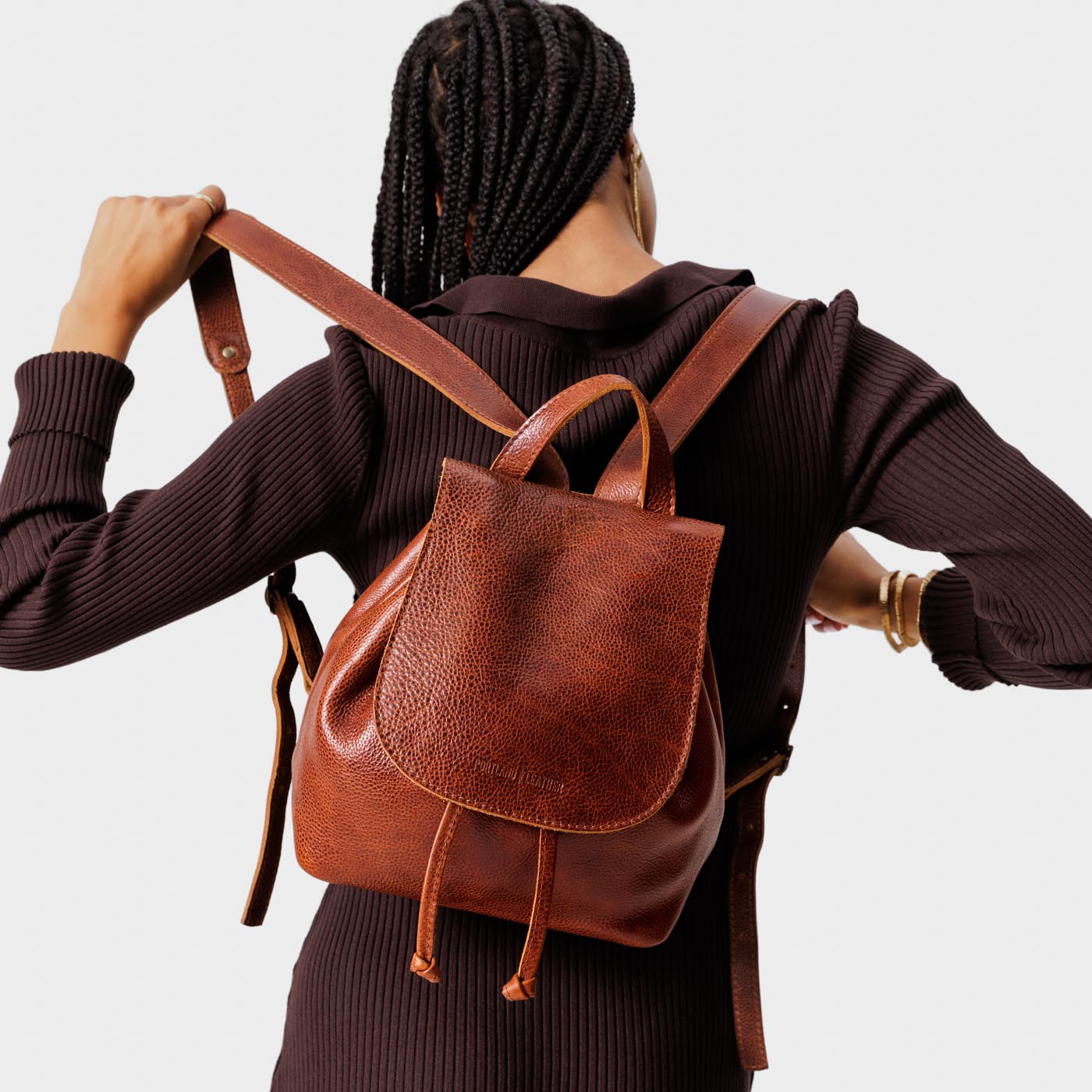 All Color: Nutmeg | Model wearing slouchy leather bucket backpack