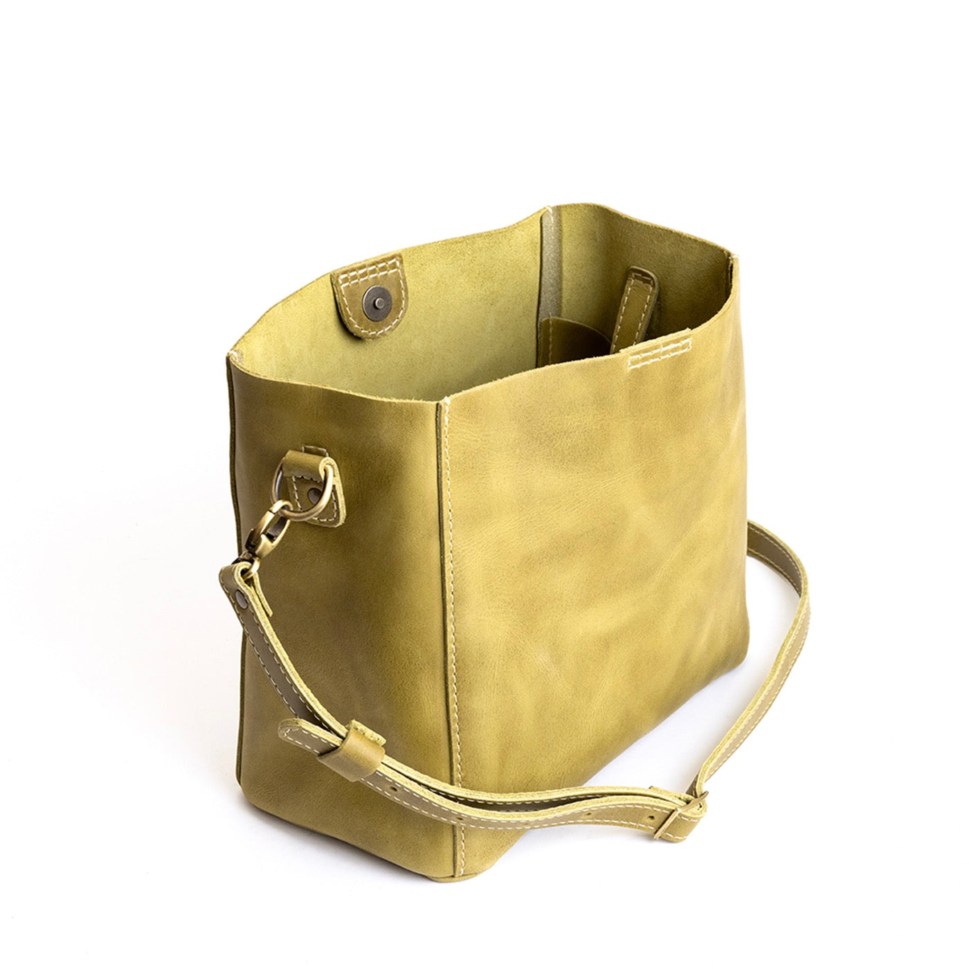 Anjou | symmetrical bucket bag with latch closure and removable crossbody strap