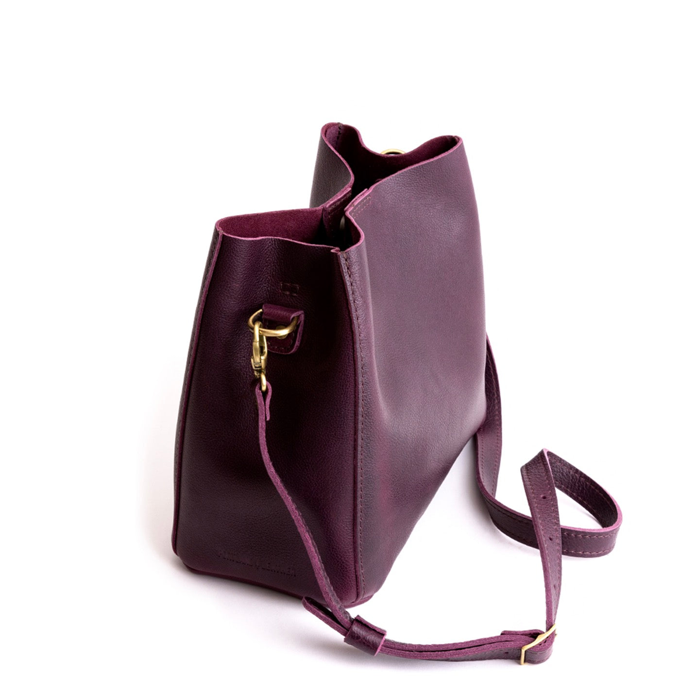 Plum | symmetrical bucket bag with latch closure and removable crossbody strap