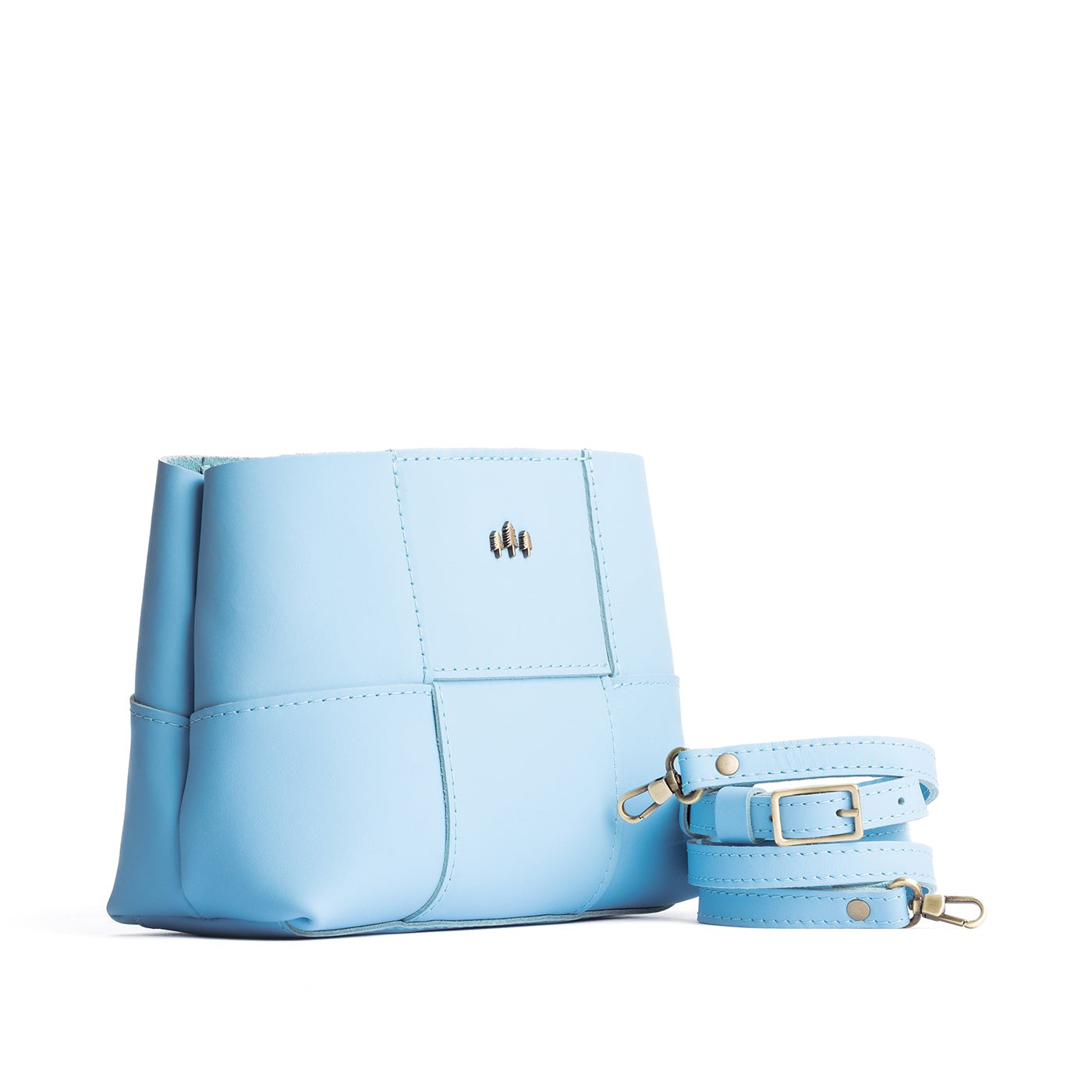 Glacial Blue Small | Structured woven leather bag with three metal tree emblems and crossbody strap