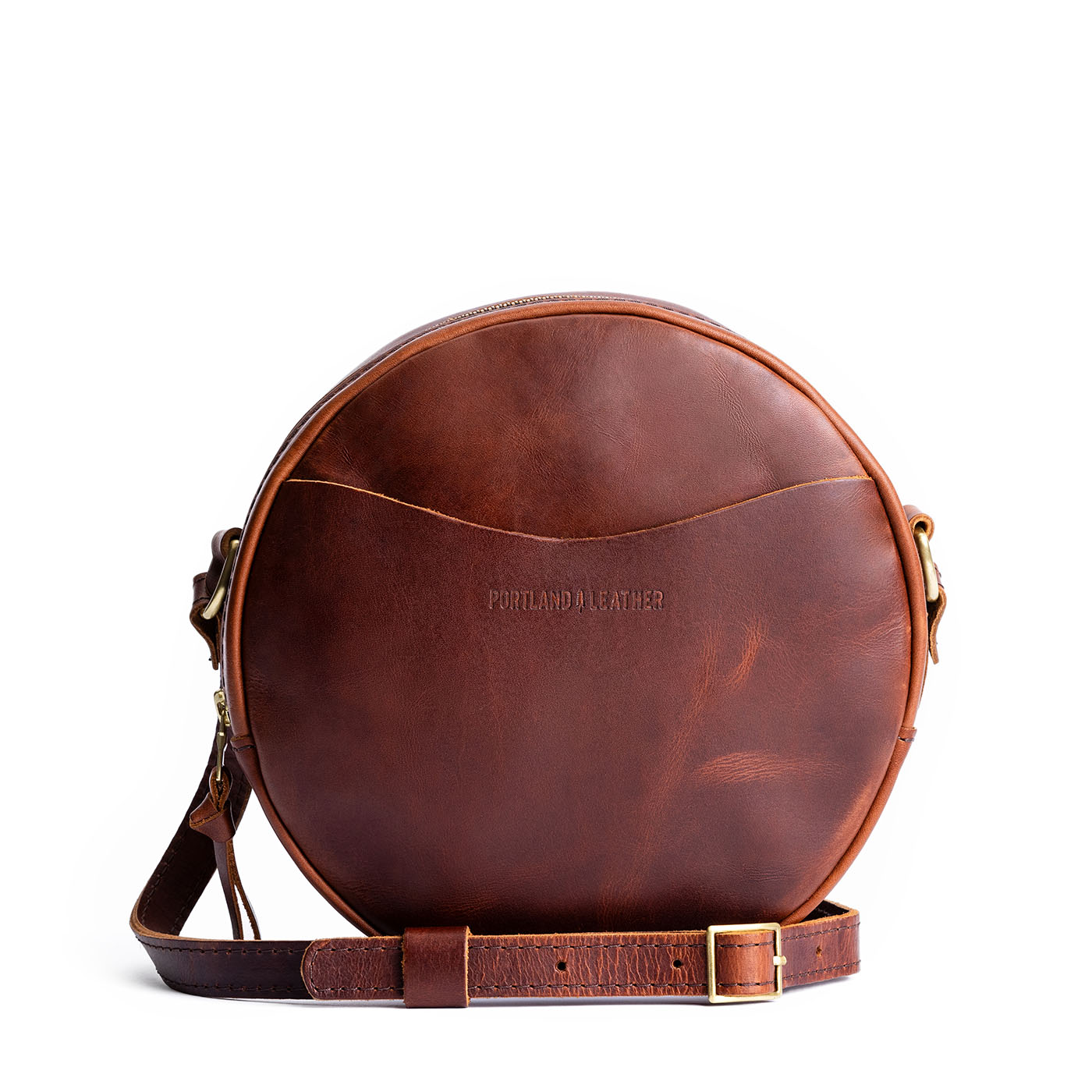 Timber Large | Circle shaped crossbody with exterior pocket and top zipper