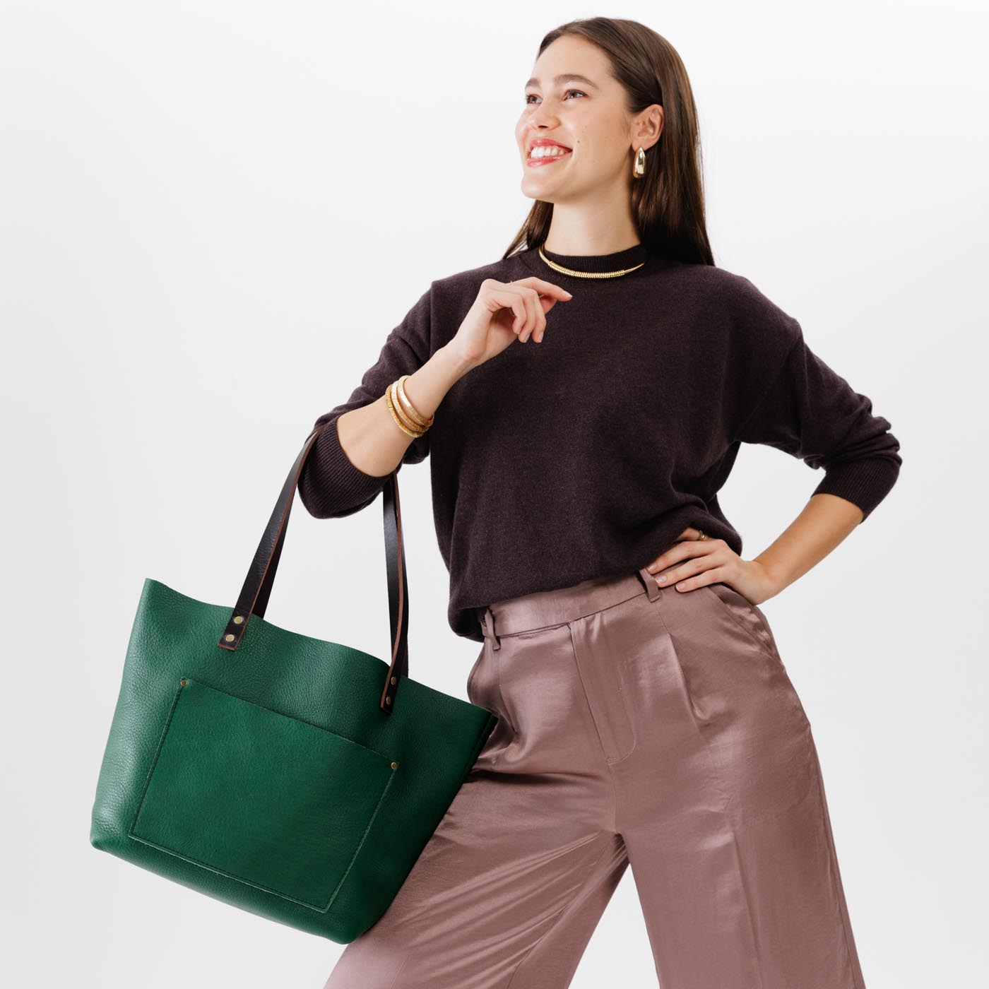 Bacalar*Classic | Model holding large leather tote bag with sturdy bridle handles and front pocket