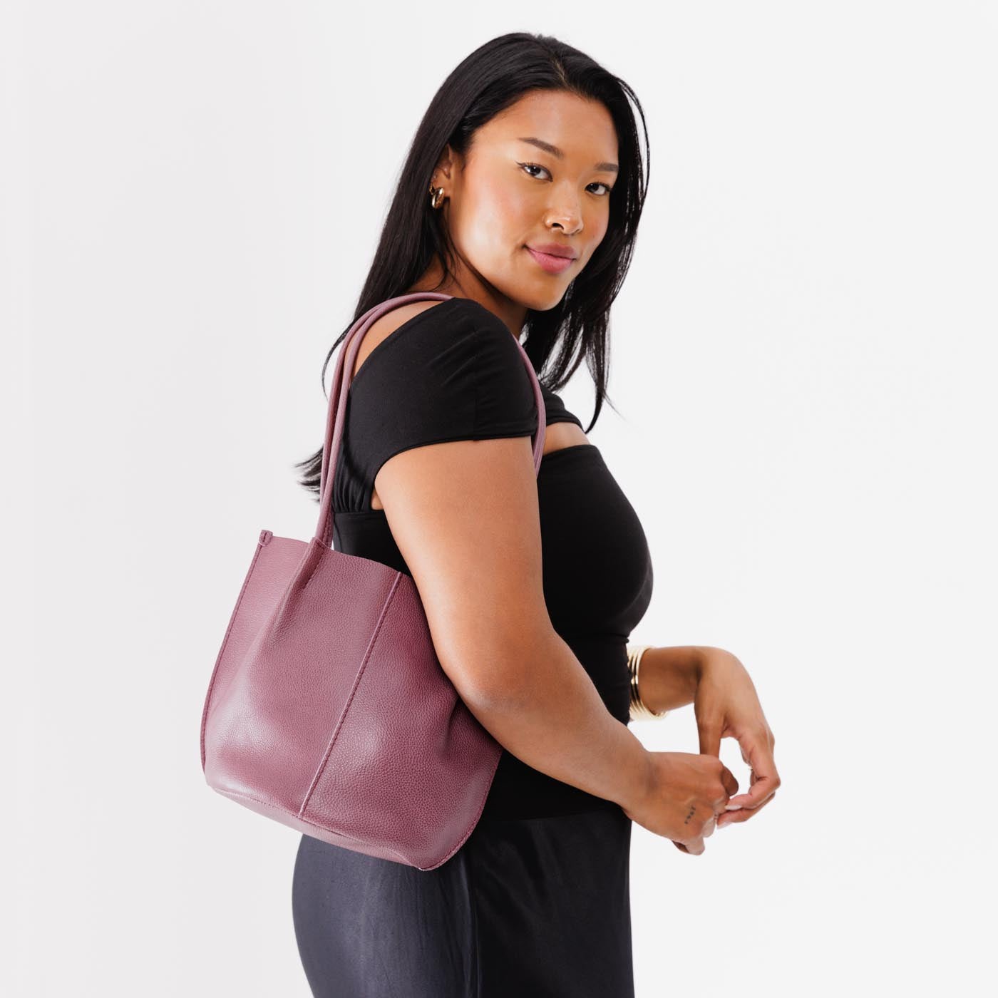 Kyoto Classic | Model holding petite bucket shaped tote bag with matching leather handles