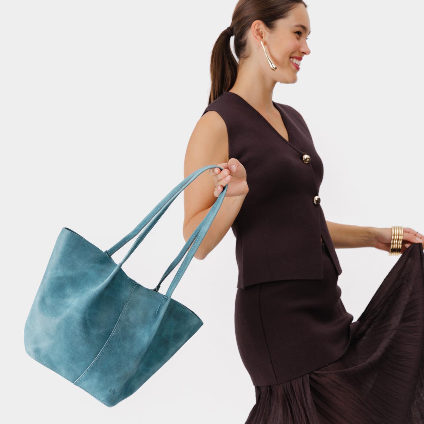 Aqua Large | Model holding wide bucket shaped tote bag with matching leather handles