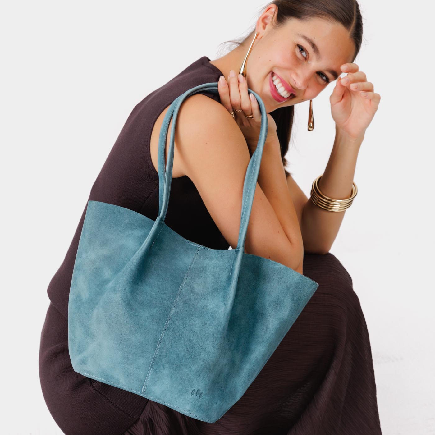 Aqua Large | Model holding wide bucket shaped tote bag with matching leather handles