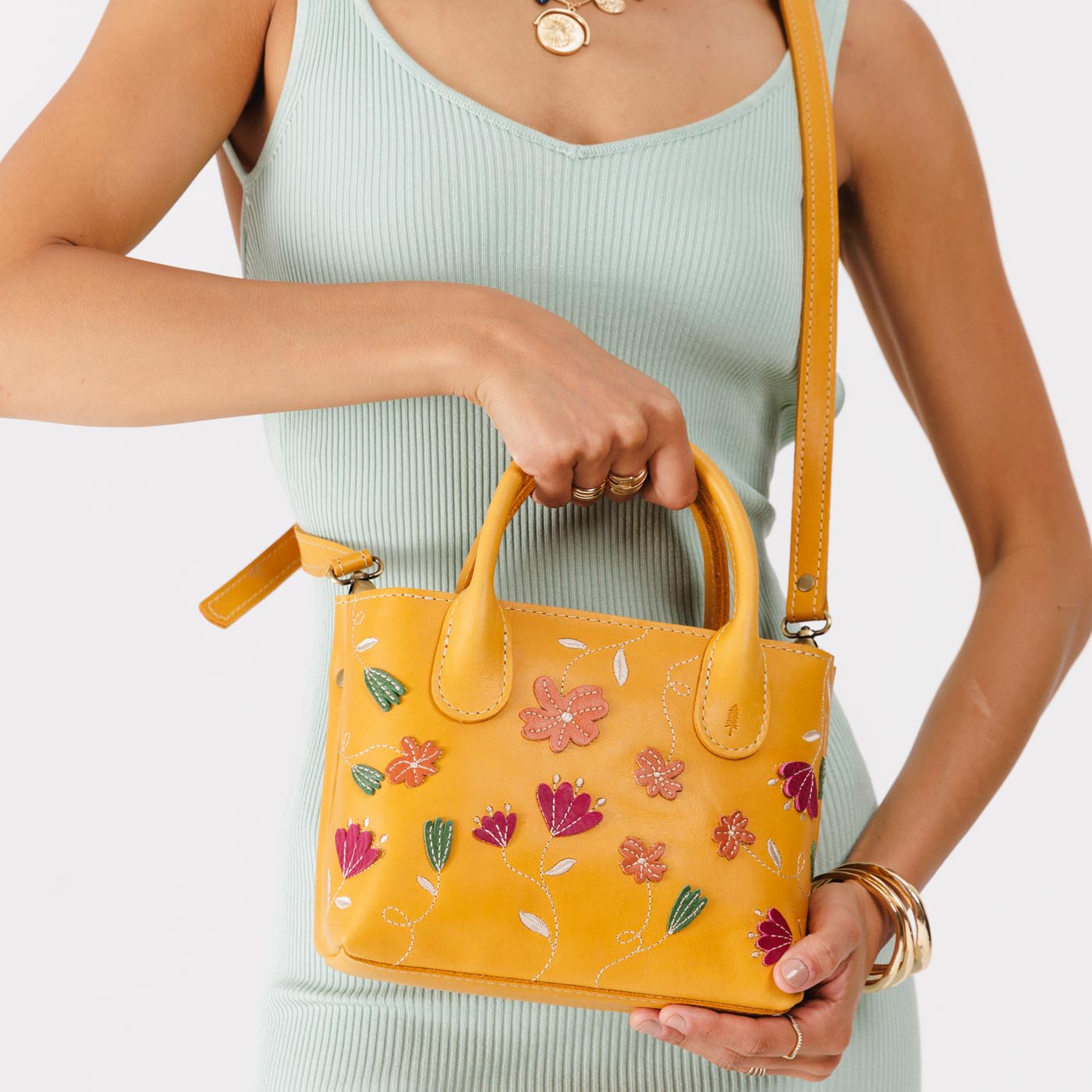 Folklore Sunflower Small | Petite tote purse with embroidered flower design, structured leather handles, and crossbody strap