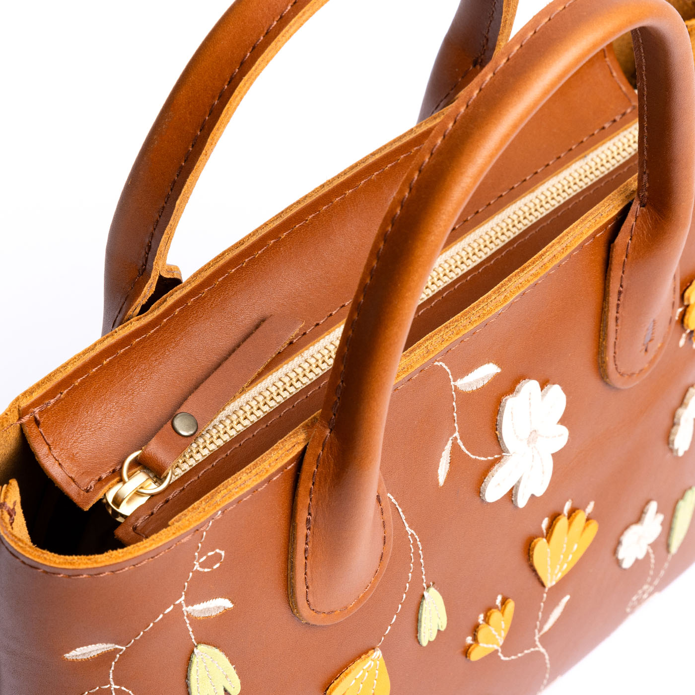 Folklore Honey*ANY*Zipper | Petite tote purse with embroidered flower design, structured leather handles, and crossbody strap