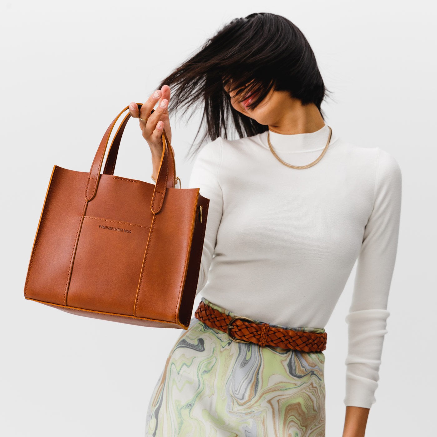 Honey | Structured mid-size tote bag with overlapping panels and crossbody strap