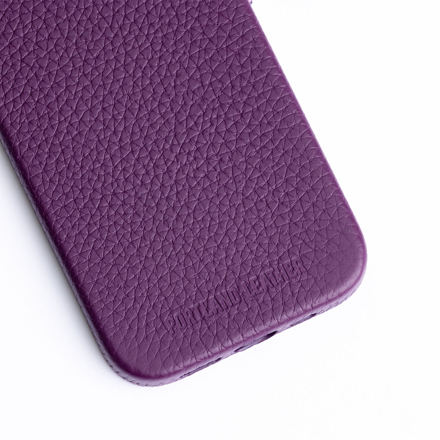 Eggplant  | Close up exterior IPhone case with signature Portland Leather logo