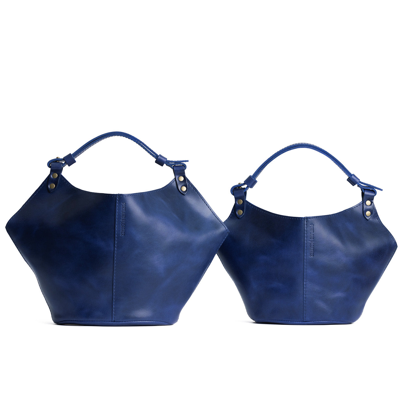 Cowboy Blue | Structured bucket shaped handbag with an adjustable shoulder strap