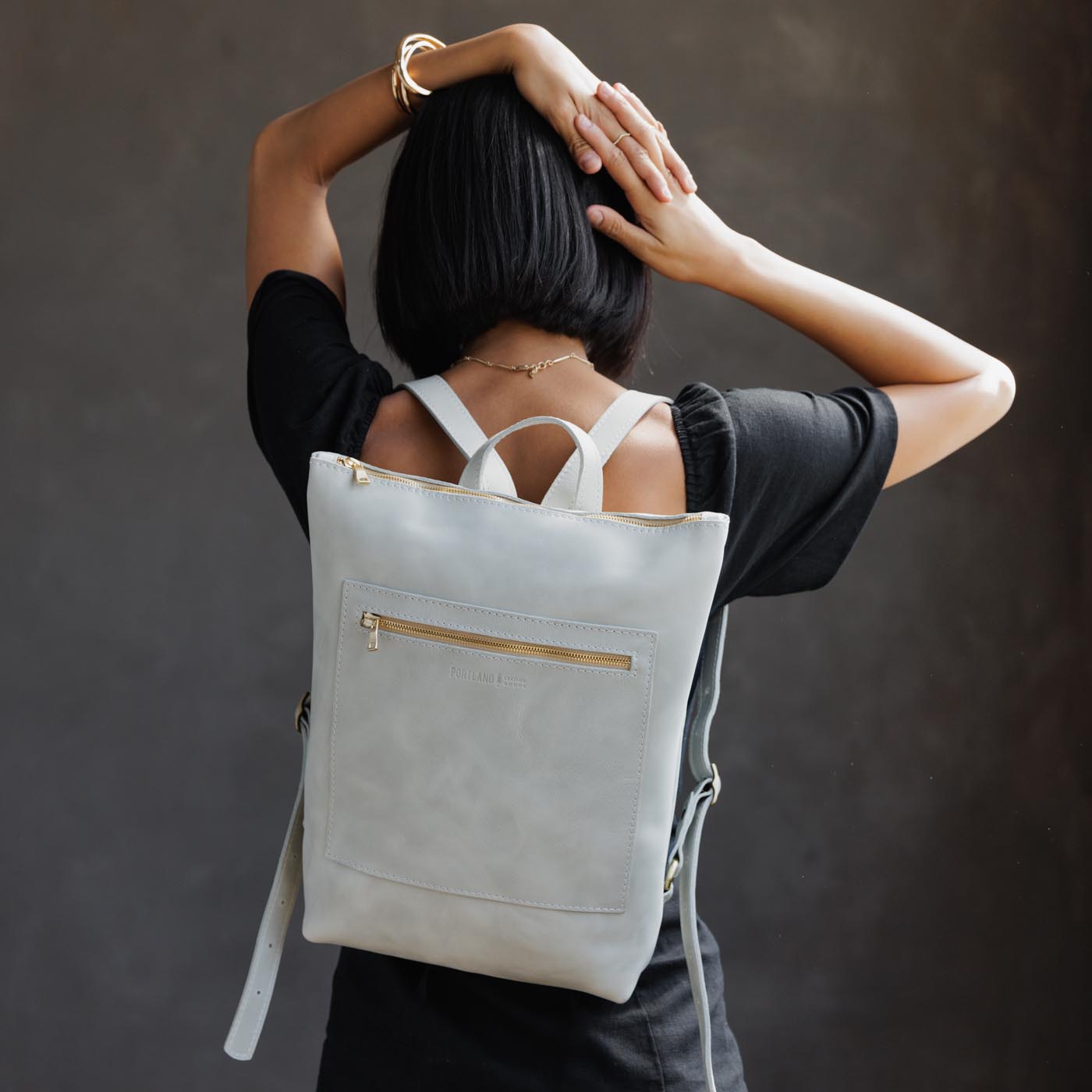 Beluga | Model wearing rectangular slim leather laptop backpack