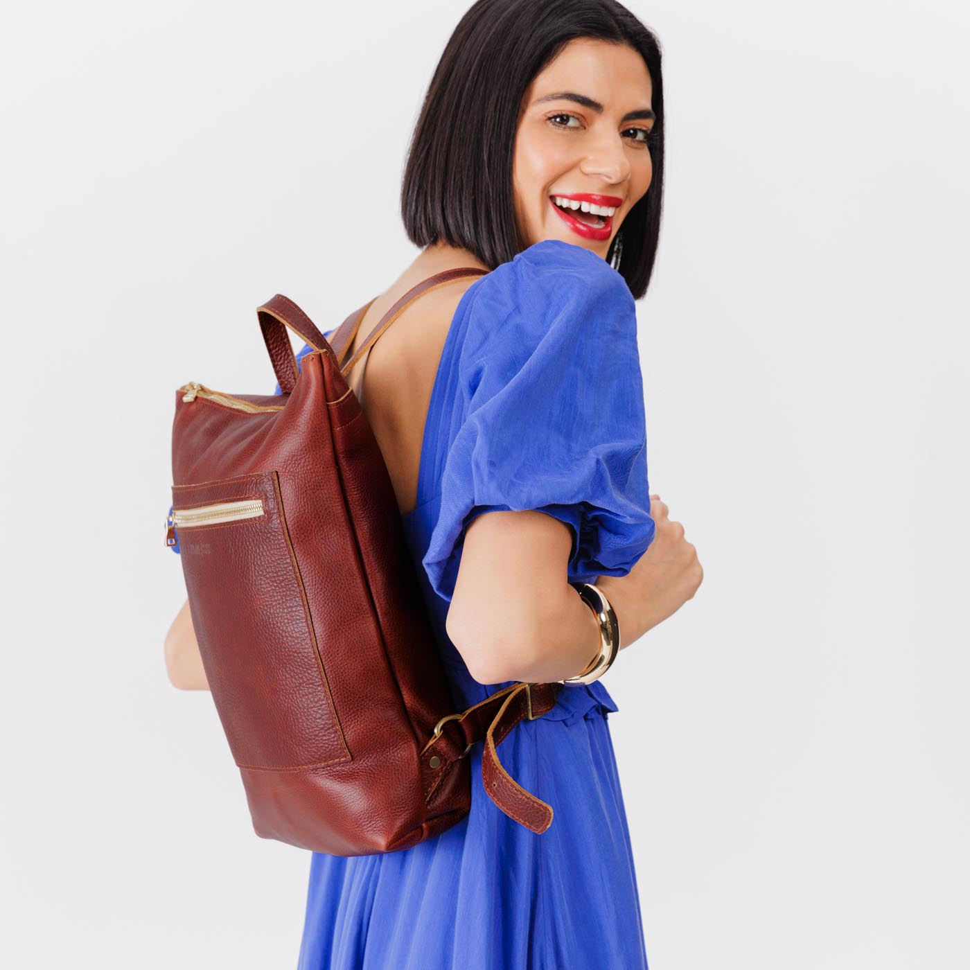 All Color: Cinnamon Bear | Model wearing rectangular slim leather laptop backpack