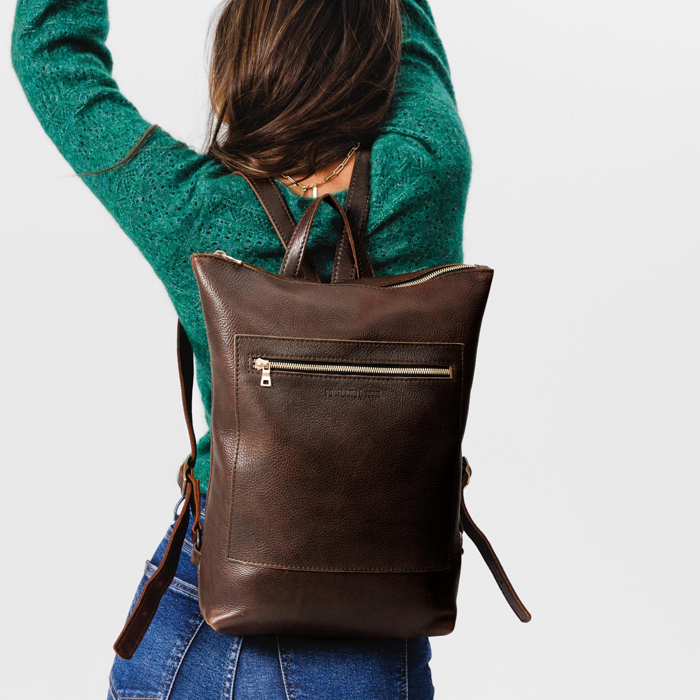 All Color: Coldbrew | Model wearing rectangular slim leather laptop backpack