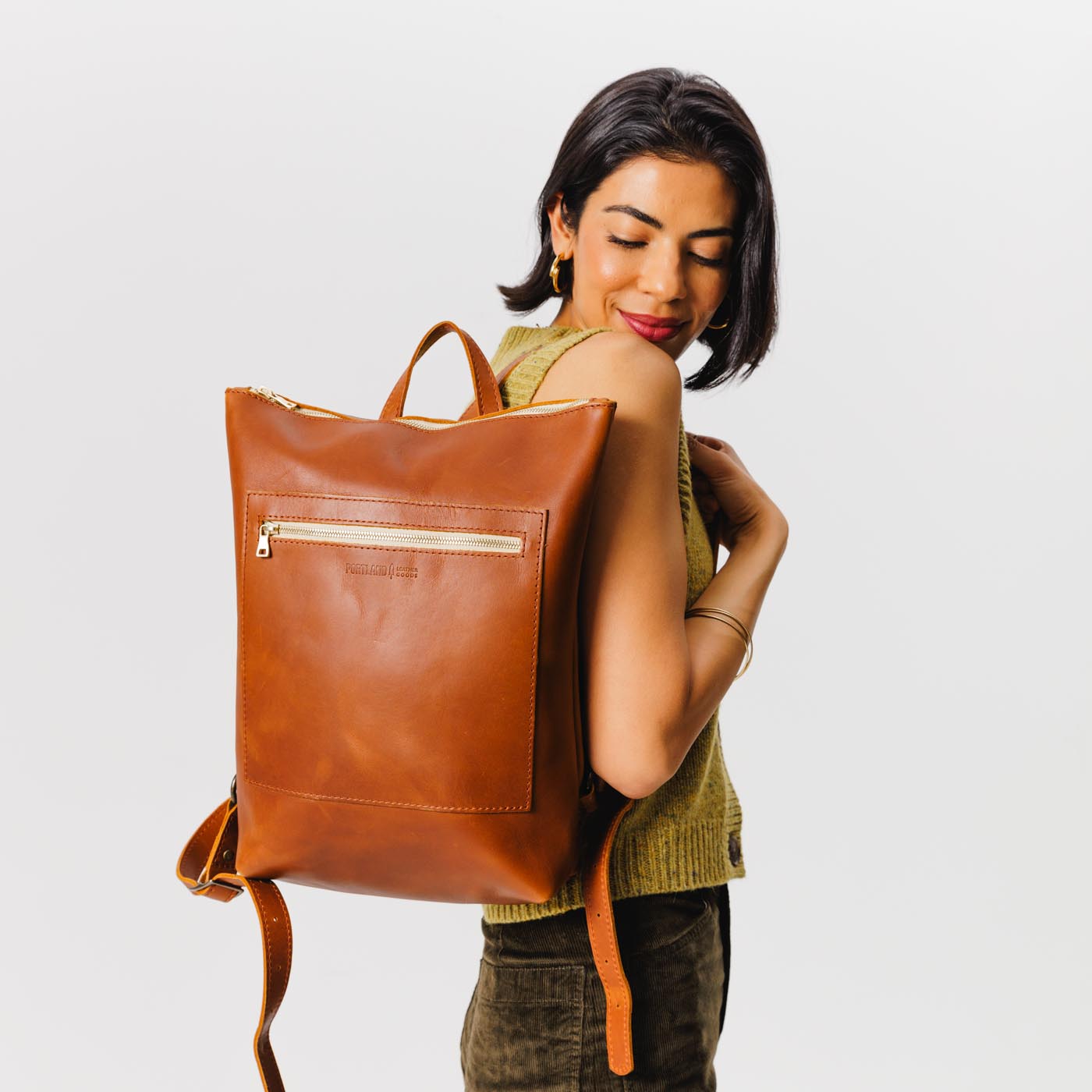 All Color: Honey | Model wearing rectangular slim leather backpack