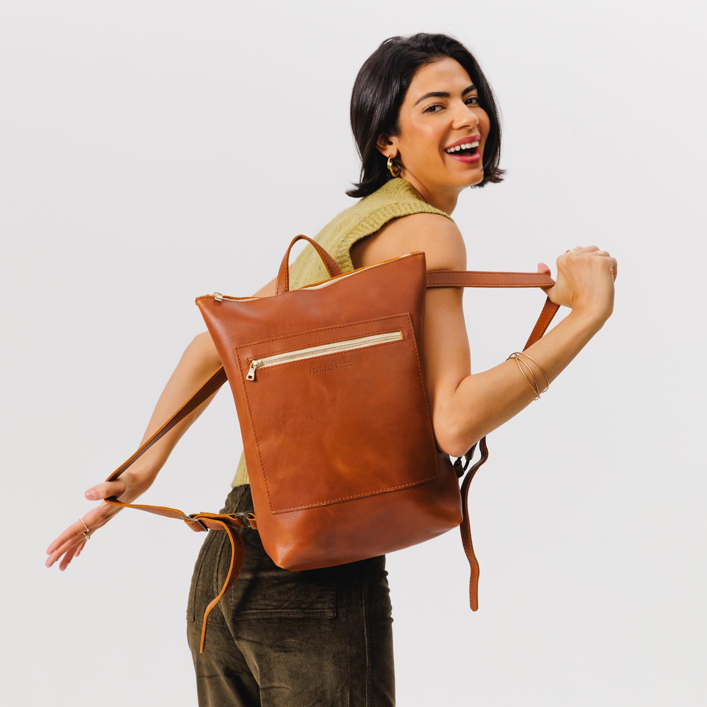 All Color: Honey | Model wearing rectangular slim leather backpack