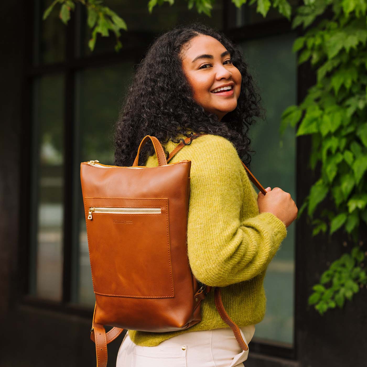 All Color: Honey | Model wearing rectangular slim leather backpack