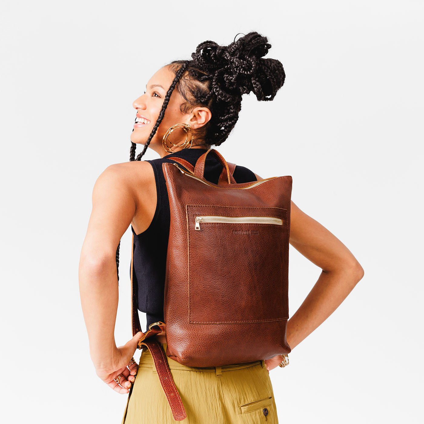 All Color: Nutmeg | Model wearing rectangular slim leather laptop backpack