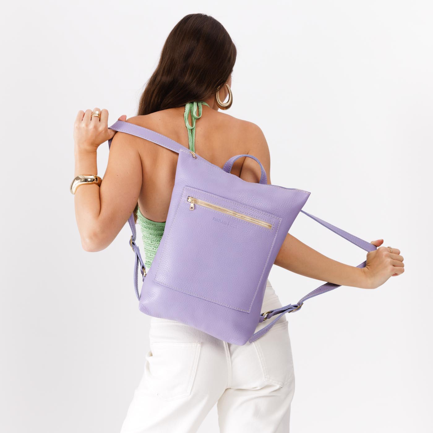 Wisteria | Model wearing rectangular slim leather laptop backpack