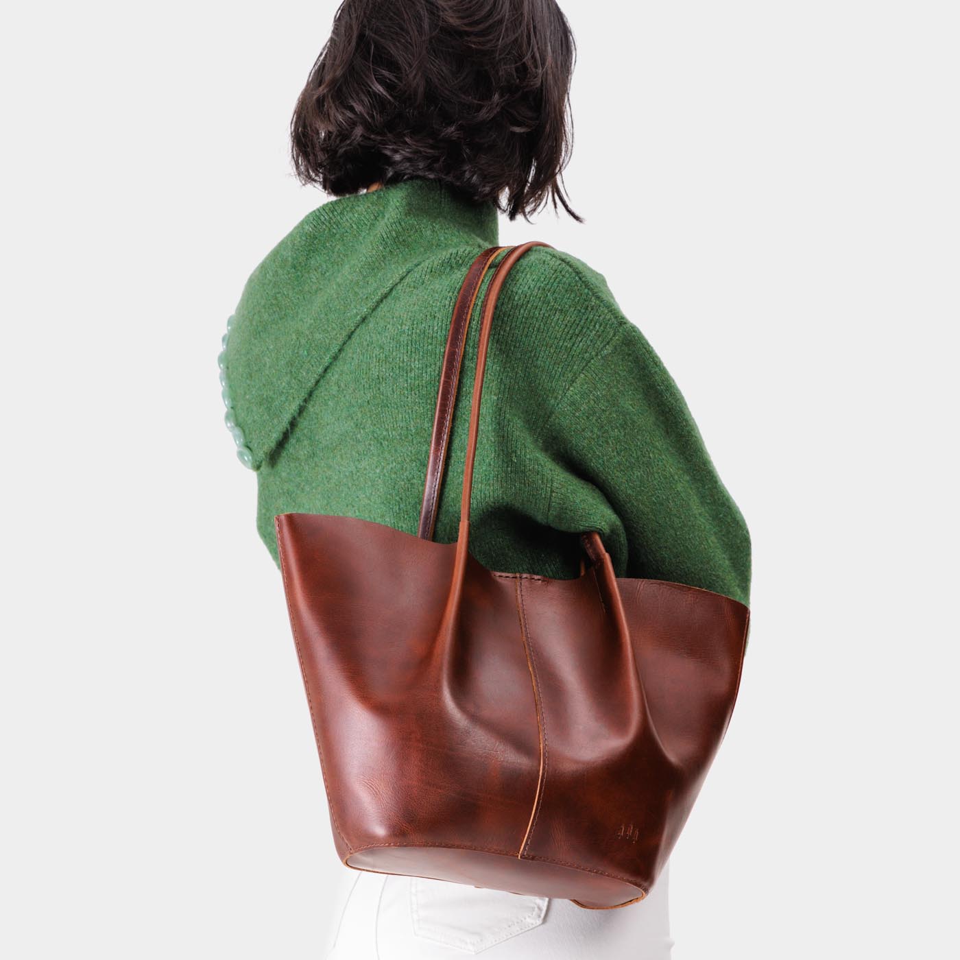 Timber*Large | Model holding wide bucket shaped tote bag with matching leather handles