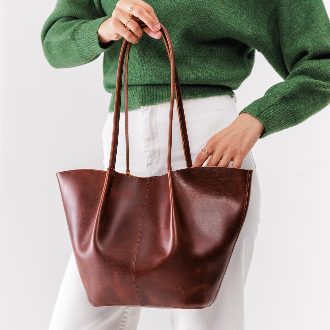 Timber*Large | Model holding wide bucket shaped tote bag with matching leather handles