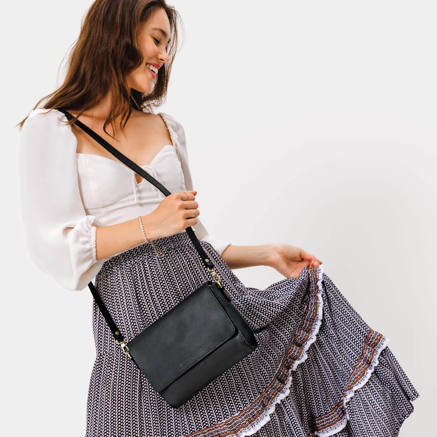 Black*Medium | Model Wearing Leather Crossbody Bag with Magnetic Messenger Bag Closure