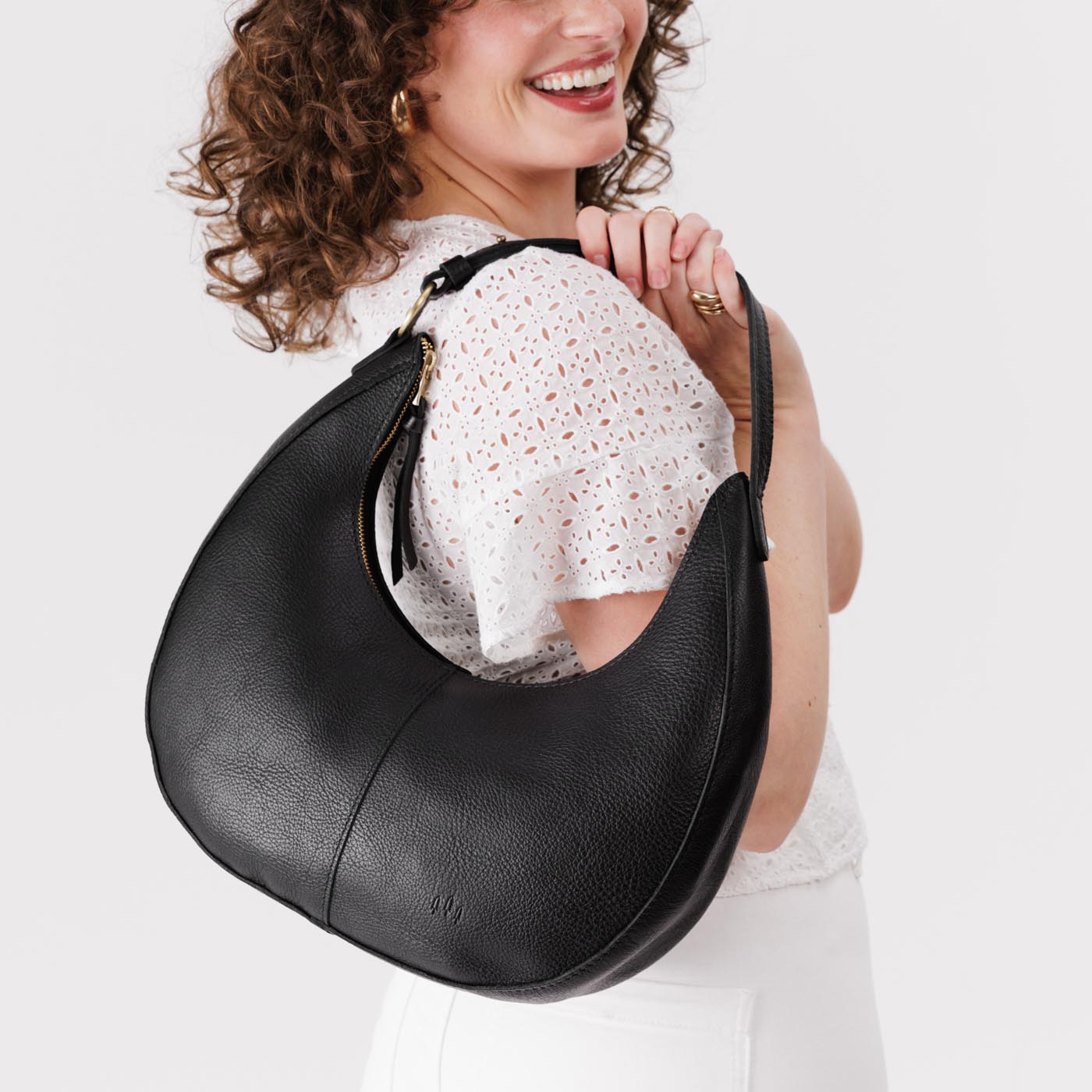 Pebbled--black Large  | Large crescent shaped shoulder bag with zipper closure and adjustable strap