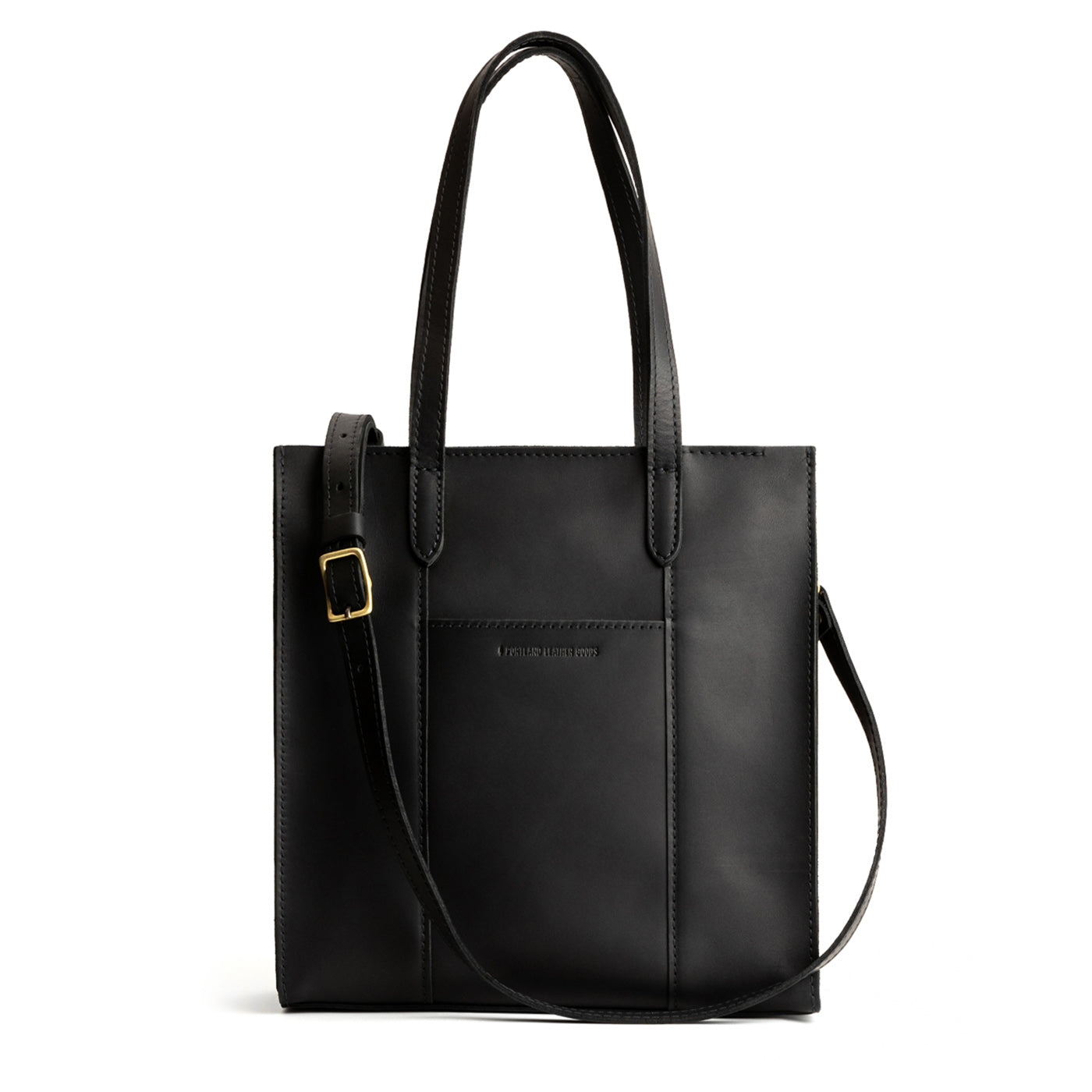 Black*North/South | Structured large tote bag with overlapping panels and crossbody strap