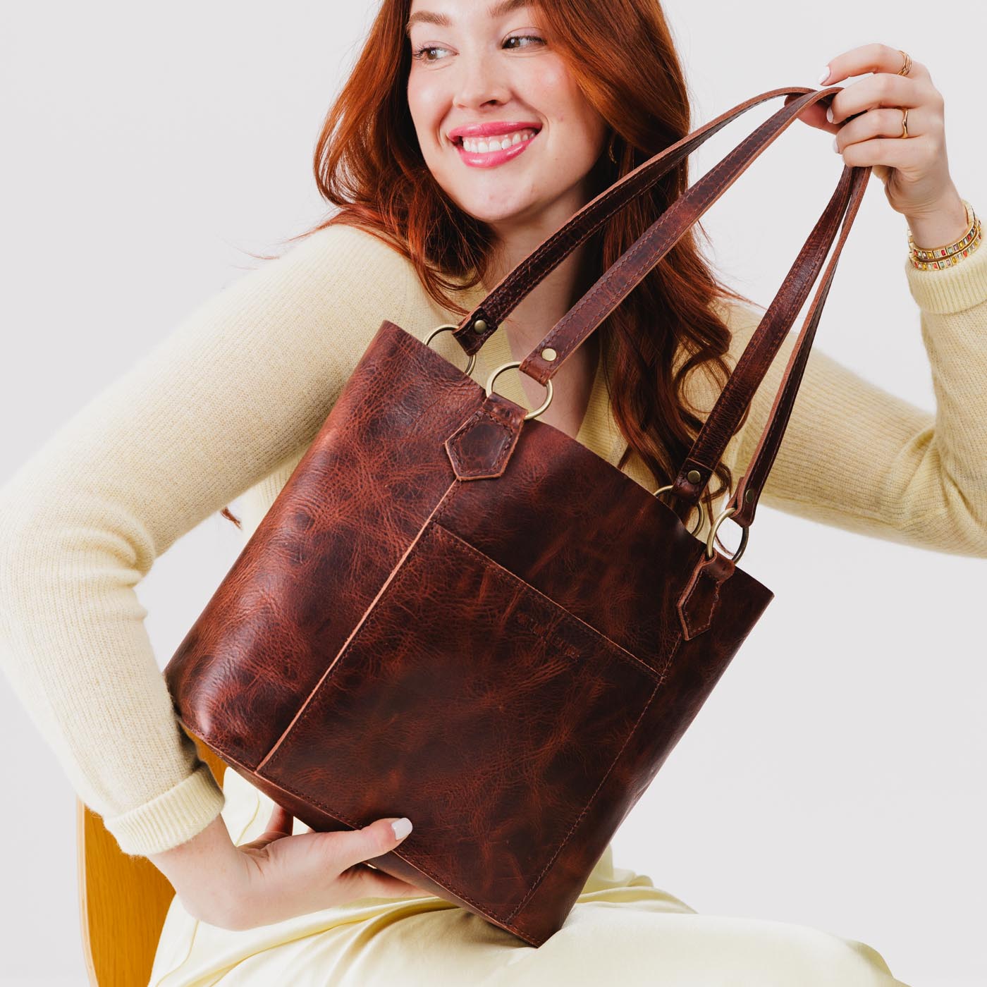  Lava | Medium tote bag with antiqued brass toned hardware and front pocket