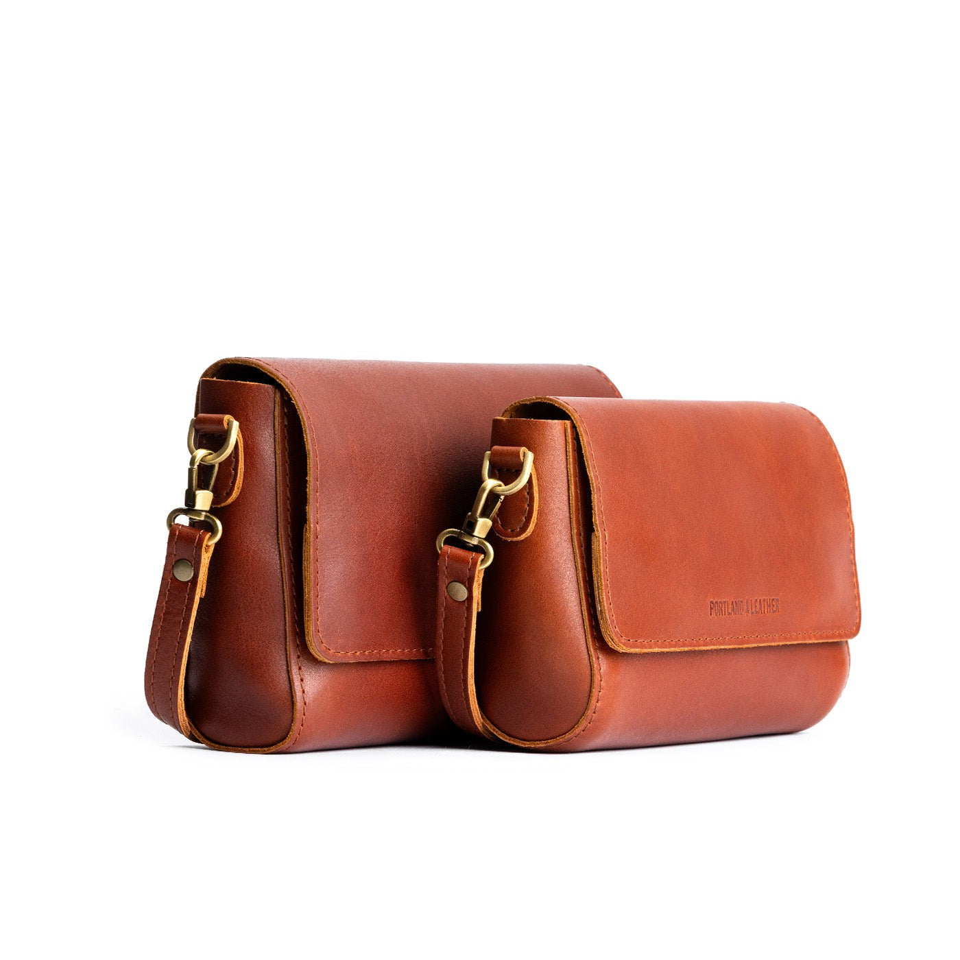 Chestnut | Side by side of both sizes of leather crossbody bag with magnetic messenger bag closure