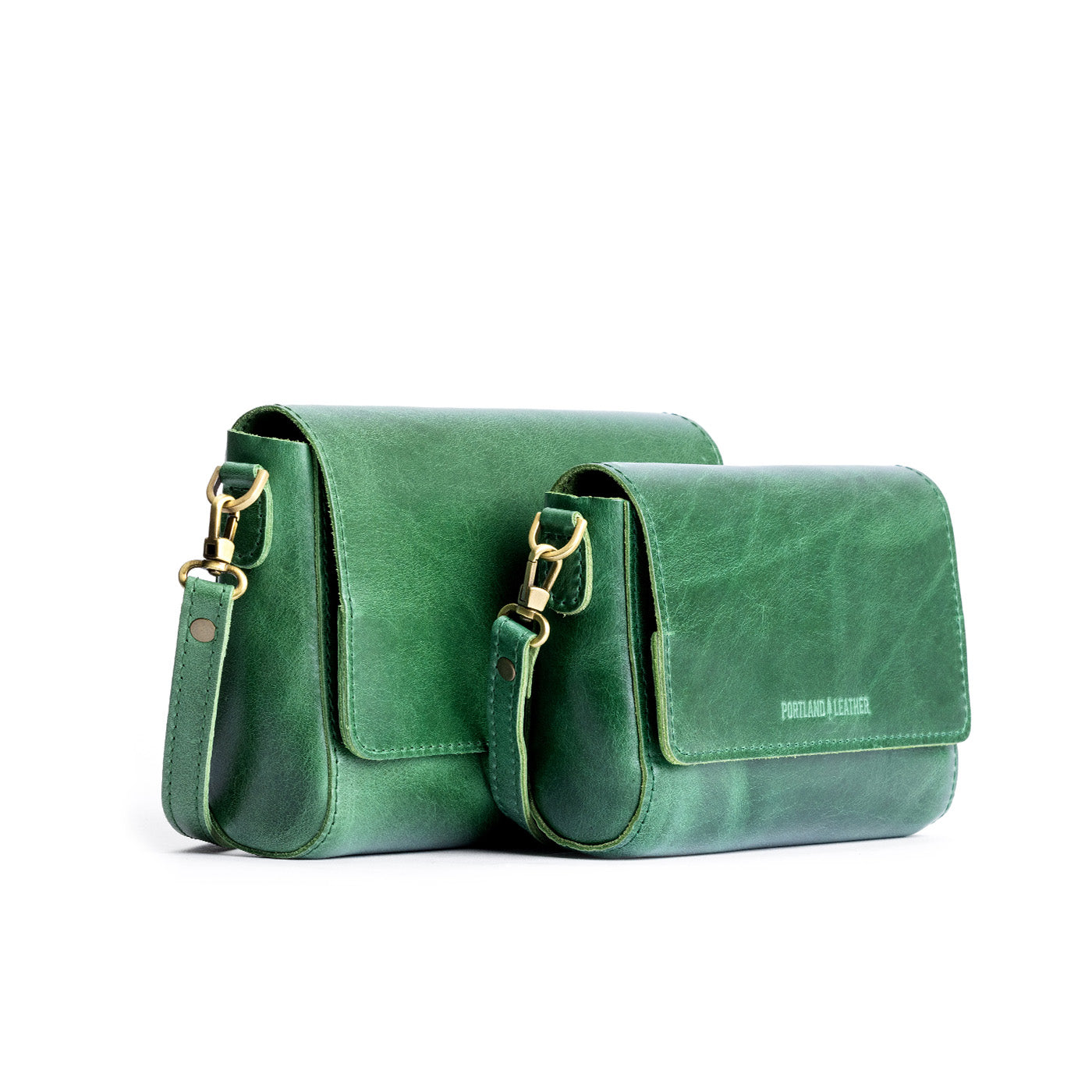 Cowboy Mint | Side by side of both sizes of leather crossbody bag with magnetic messenger bag closure