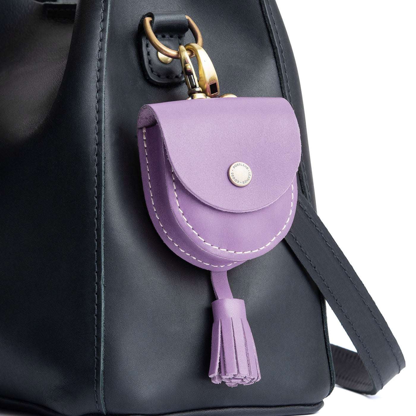 All Color: Lavender | U shaped pouch with snap closure, lobster clasp and fringed tassel