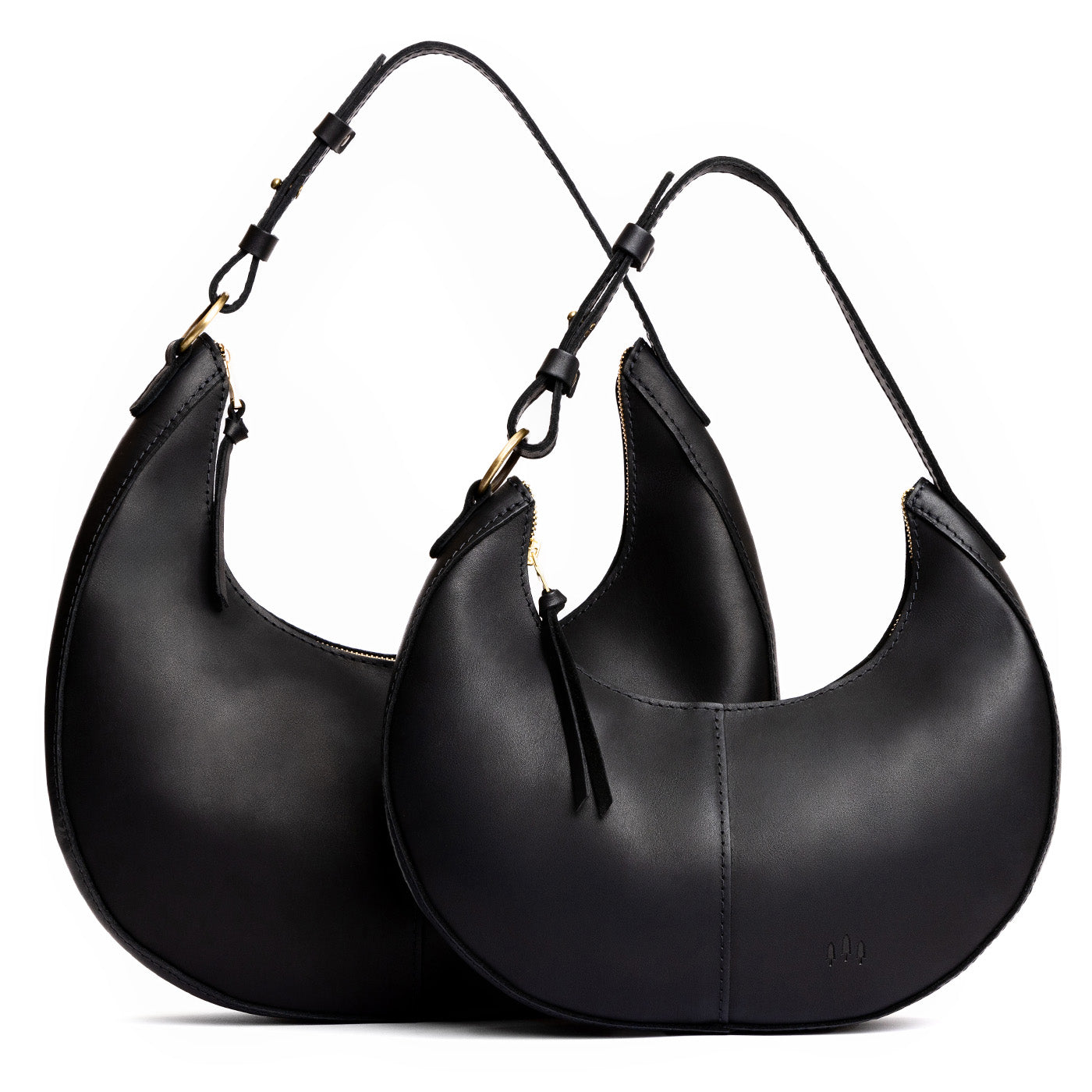 Black | Crescent shaped shoulder bag with zipper closure and adjustable strap