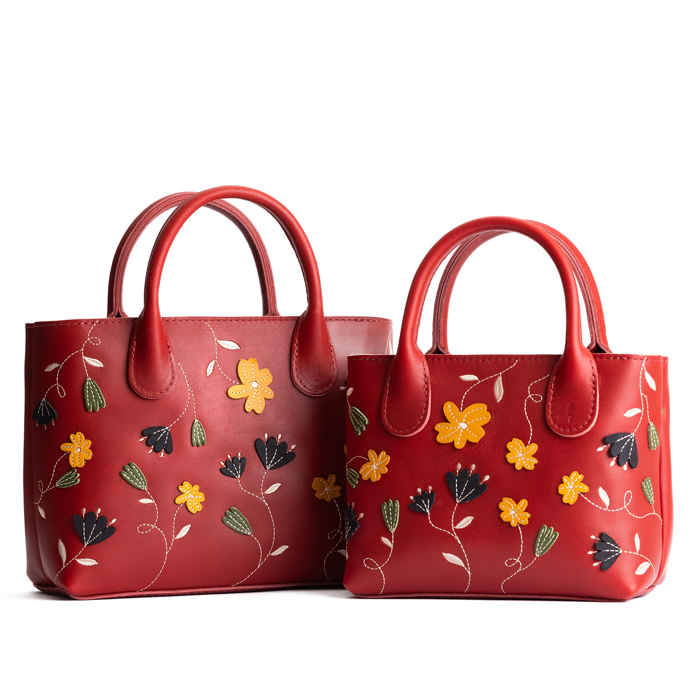 Folklore Ruby | Petite tote purse with embroidered flower design, structured leather handles, and crossbody strap