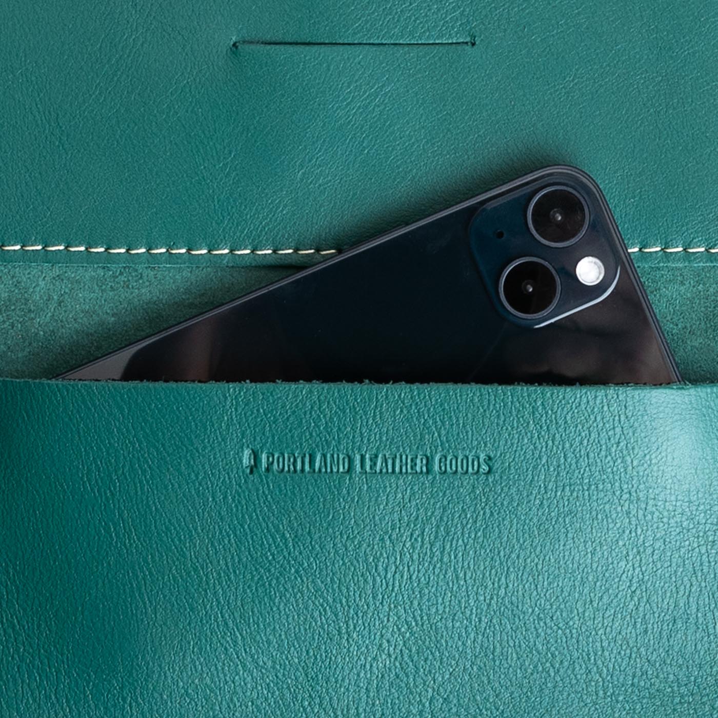 Peacock | Leather wallet inside pocket with iphone