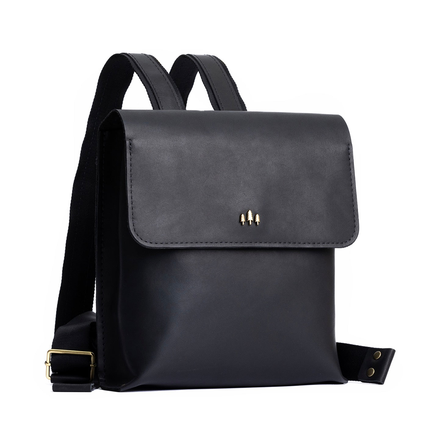 Black | Rectangular backpack with leather lined nylon straps and magnetic flap closure