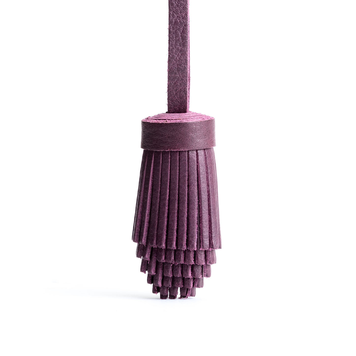 All Color: Plum | Pom-pom style with tiered leather fringe