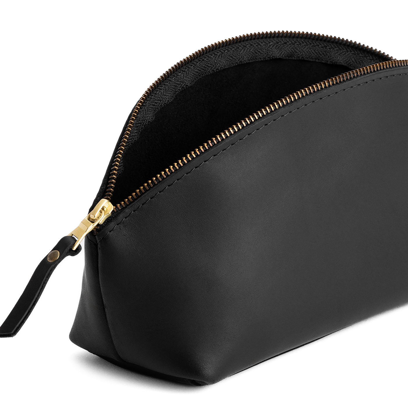 Black | Spacious leather makeup bag with curved seams and top zipper