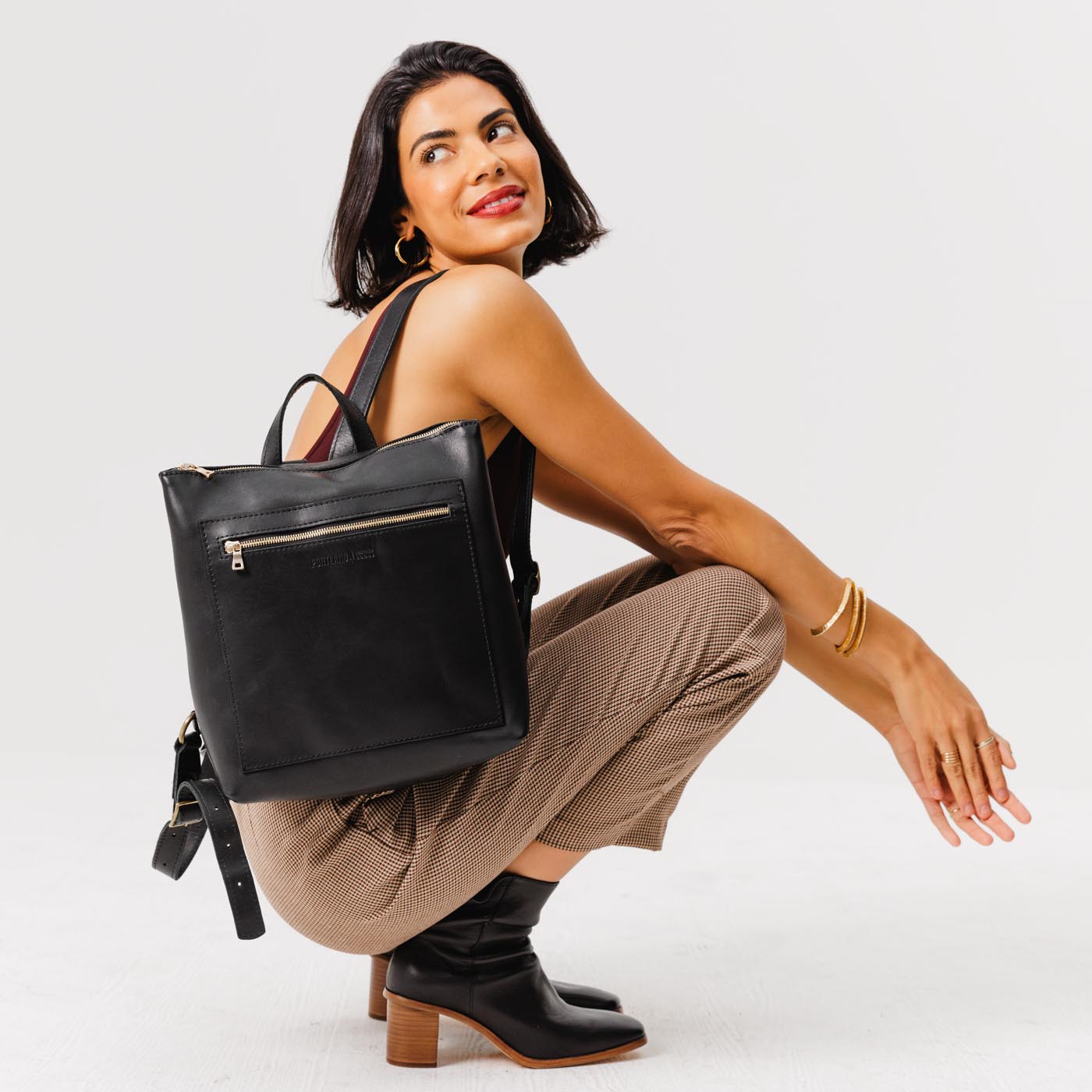 All Color: Black | Model wearing square slim leather tote backpack