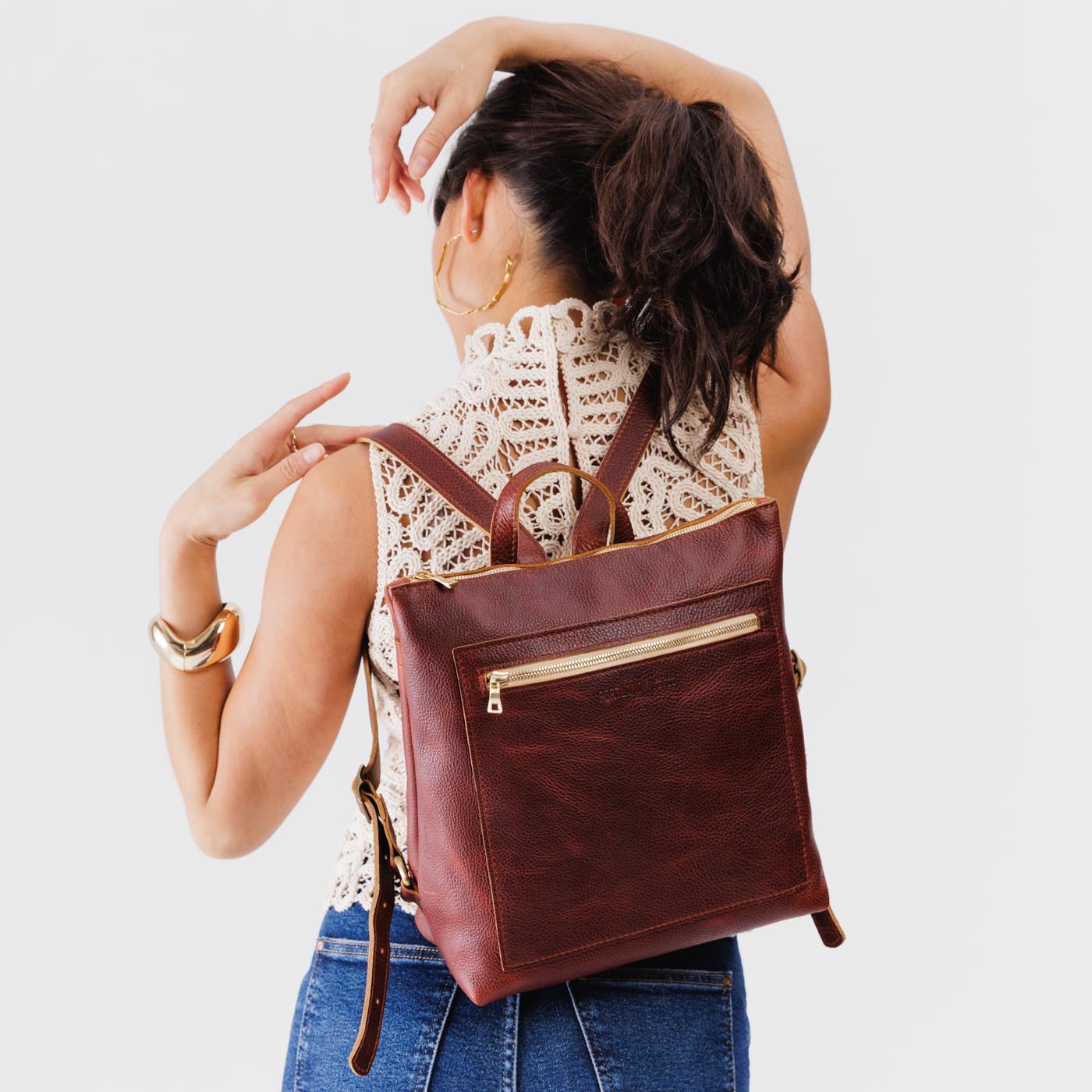 Cinnamon Bear | Model wearing square slim leather tote backpack