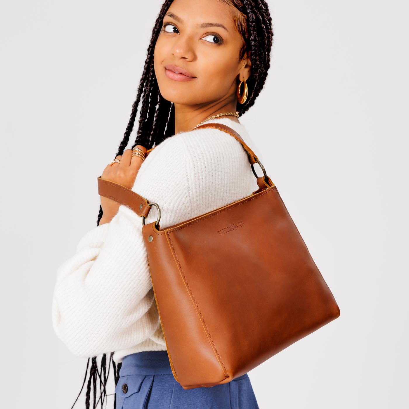  Honey | Triangular shoulder bag with antiqued brass finished hardware