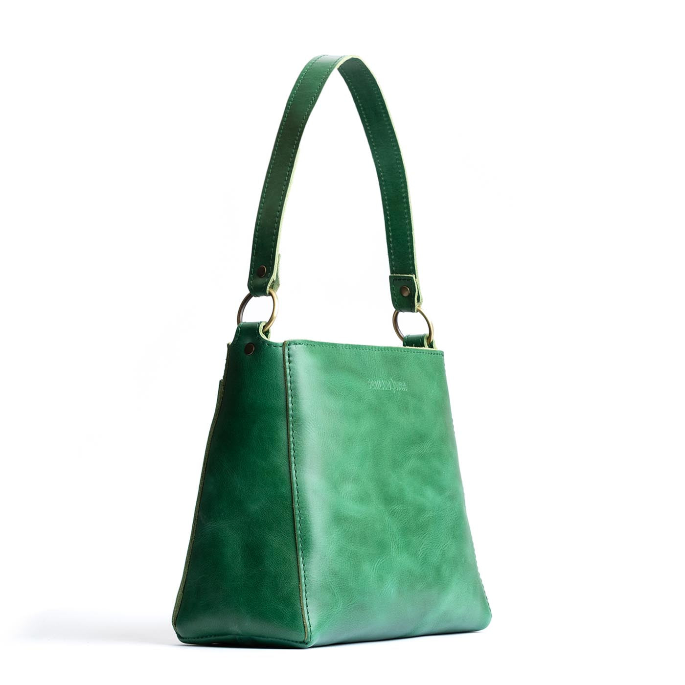 Cowboy Mint | Triangular shoulder bag with antiqued brass finished hardware