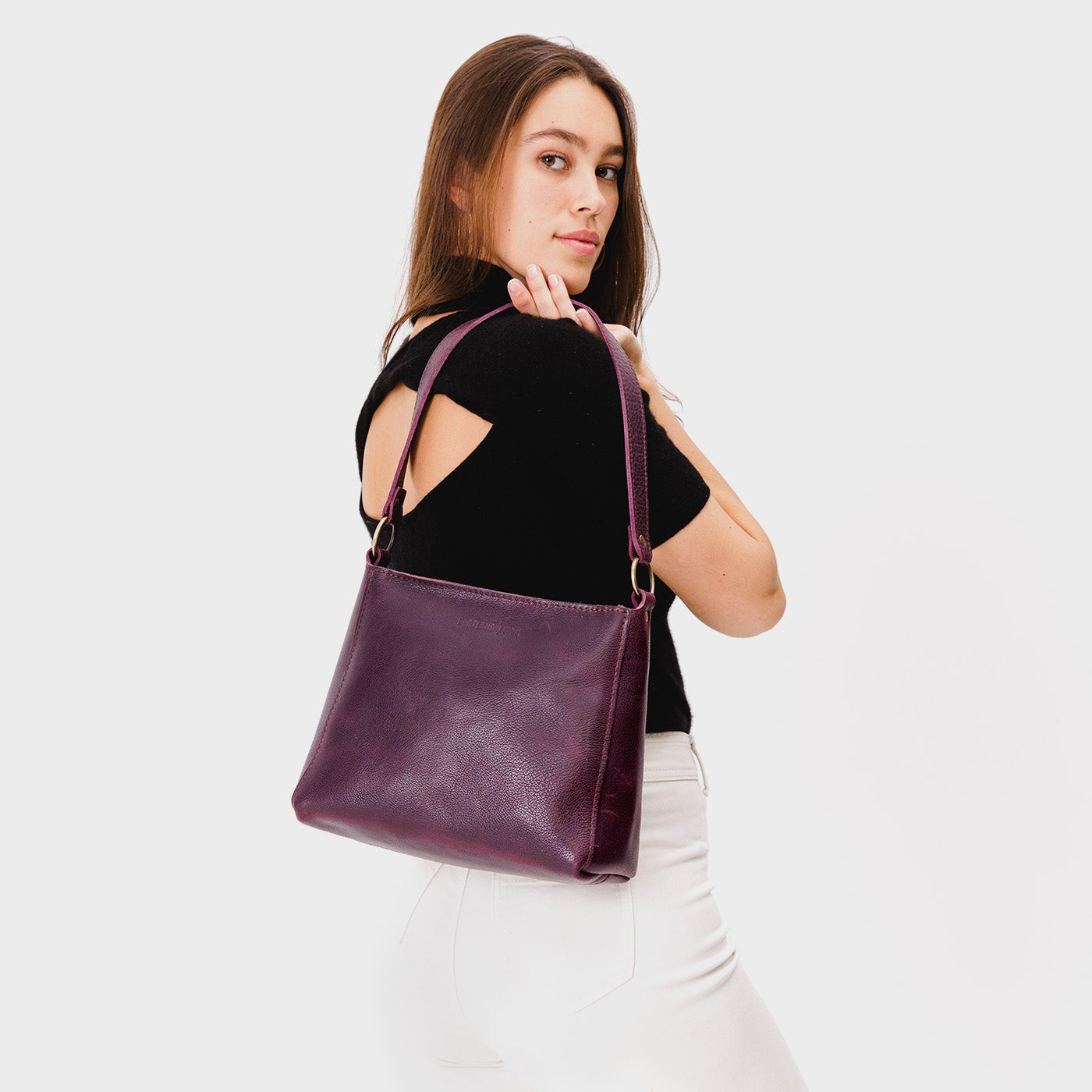  Plum | Triangular shoulder bag with antiqued brass finished hardware