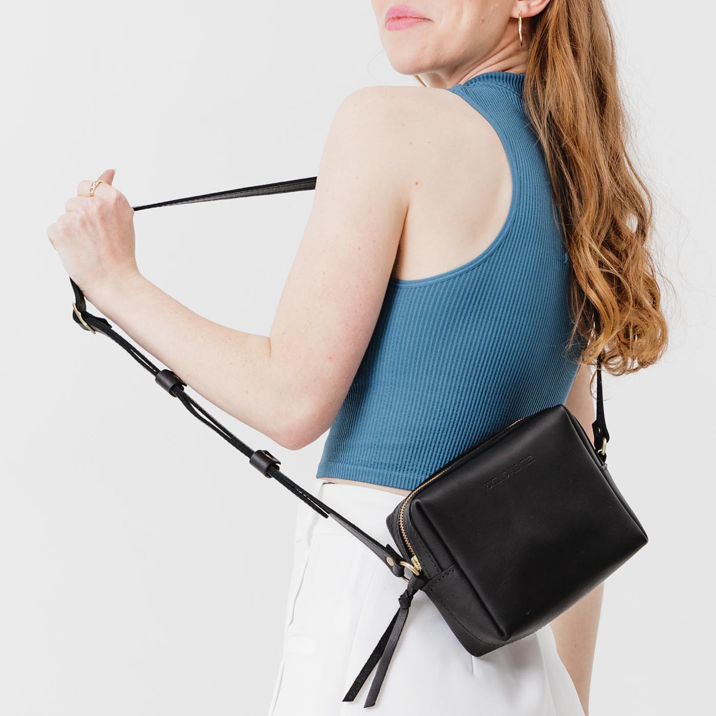  Black | Square crossbody bag with top zipper and leather pull tab