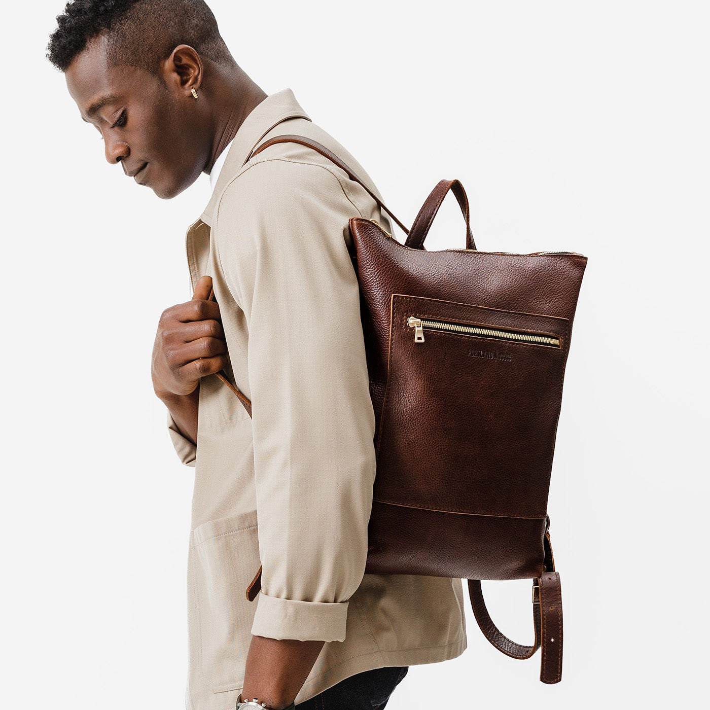 All Color: Coldbrew | Model wearing rectangular slim leather laptop backpack