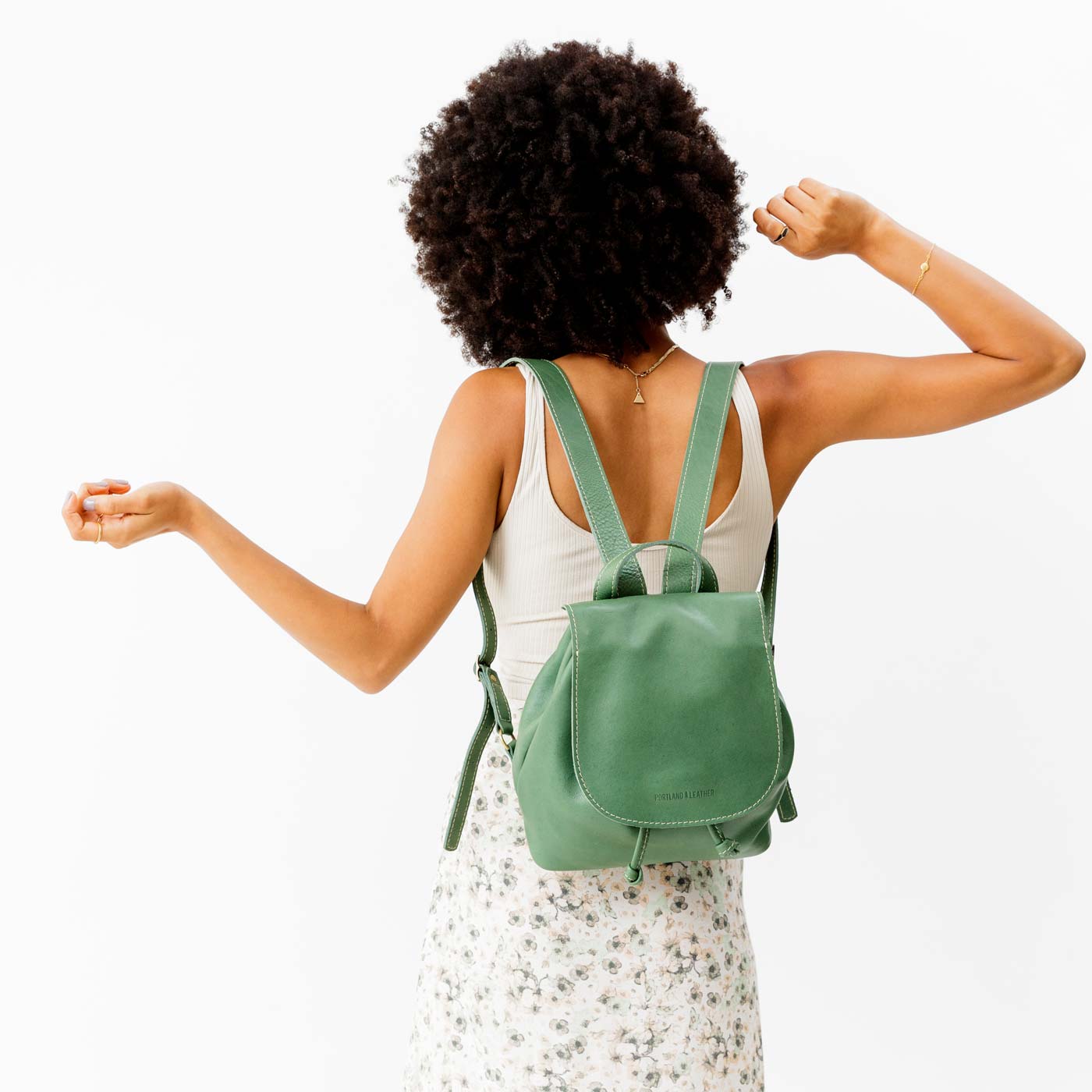 All Color: Eucalyptus | Model wearing slouchy leather bucket backpack