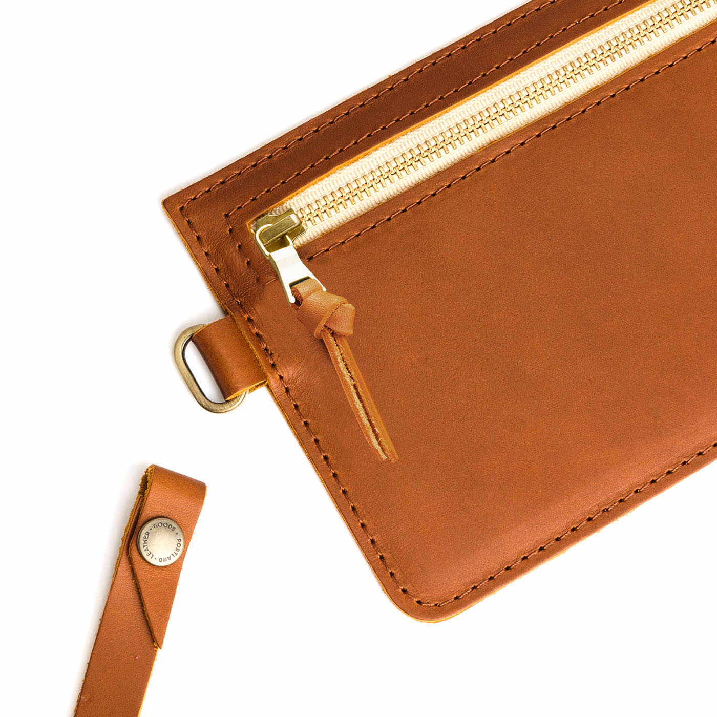 Honey | Flat leather pouch with zipper and wristlet close up